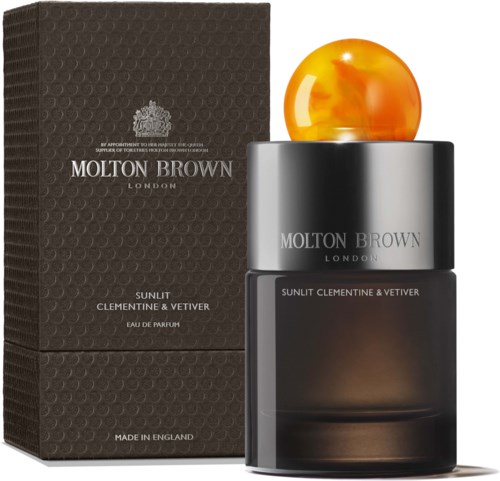 Ein Parfümflasche mit orange rundem Deckel, schwarzem Körper und Verpackung mit Marken- und Duftinformationen.