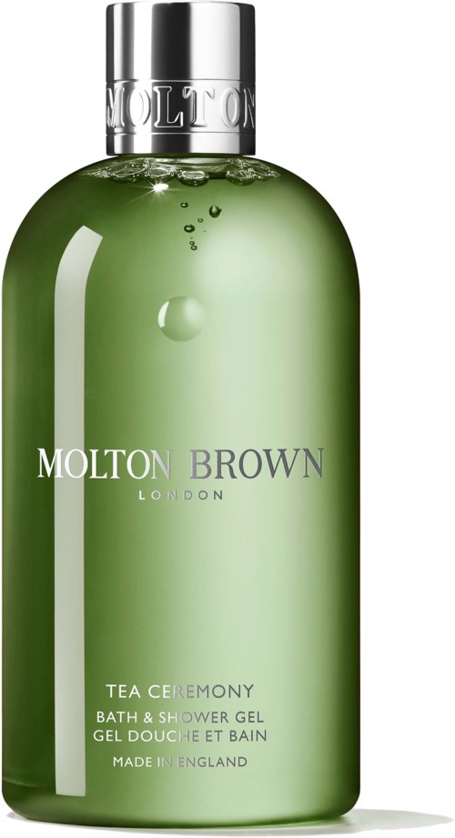 Grüne Bad- und Duschgel-Flasche mit silberner Kappe, beschriftet 'Molton Brown London Tea Ceremony'.
