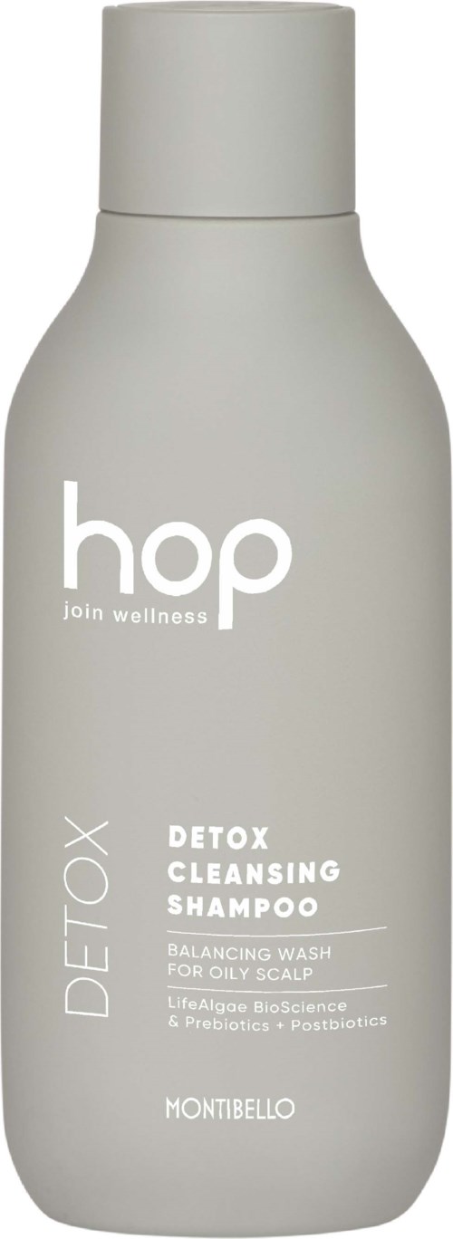 En grå flaske merket med 'hop join wellness' og 'Detox Cleansing Shampoo' for hodebunn og hårpleie.