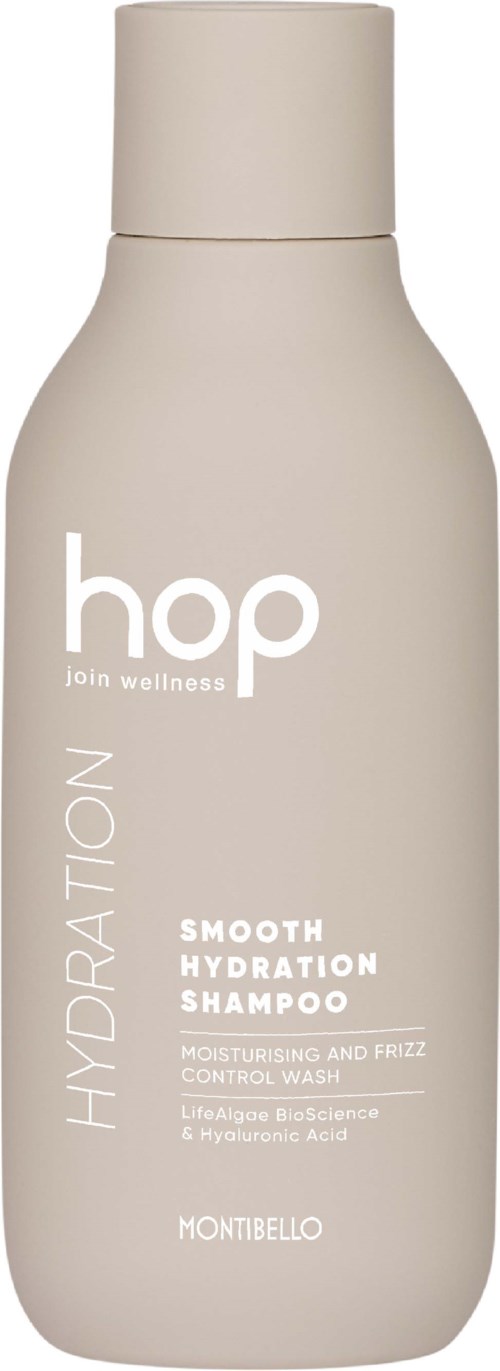 En beige flaske med Hop Hydration Shampoo med hvit tekst, designet for fukting og kontroll av bust, fra Montibello.