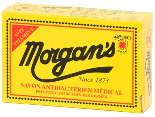 En gul eske med Morgan's antibakterielle såpe med svart og rød tekst, fremhever vitamin E og beskyttelse mot bakterier.