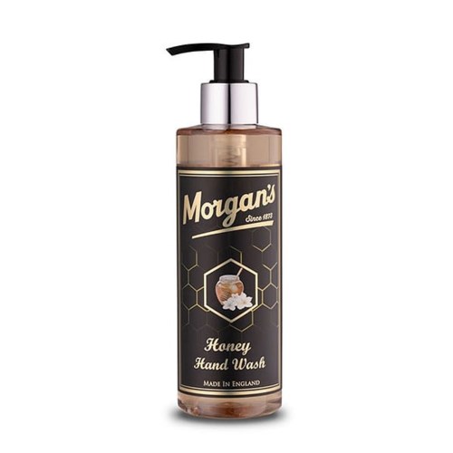 A clear bottle with a black pump labeled Morgan's Honey Hand Wash, with honey and honeycomb illustrations.
