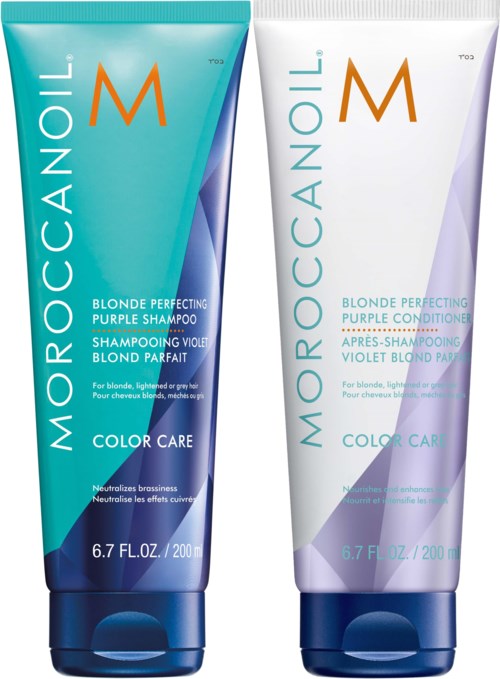 Two bottles of hair care products, one blue and one white, labeled 'Moroccanoil' and 'Blonde Perfecting'.