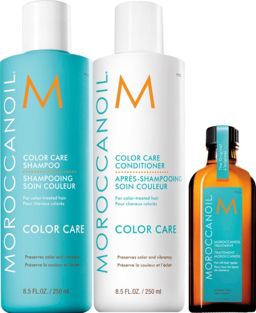 Three MoroccanOil products for hair: shampoo, conditioner, and treatment, all with blue and white labels.