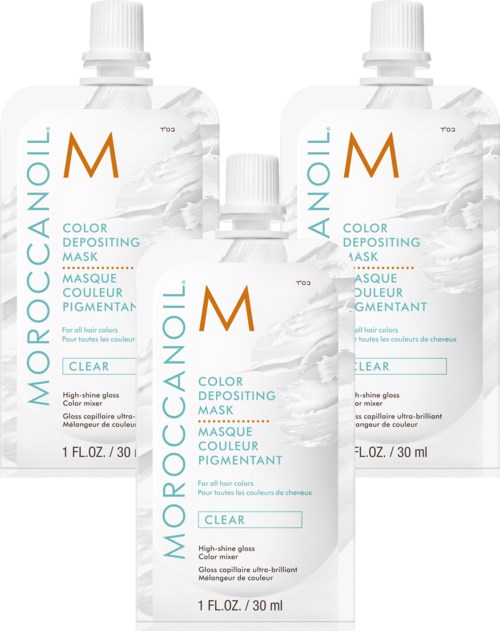 Kolme Moroccanoil-värjäysmaski-sarjaa, merkitty kirkkaaksi, kiiltävään hiukseen. Kirkas, yksinkertainen pakkauksen muotoilu.