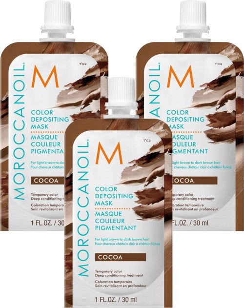 Kolme pientä ruskeaa pussia kosmetiikkatuotteelle, merkinnällä 'Moroccanoil' ja kaakaovalikoima, hiusten värjäykseen.