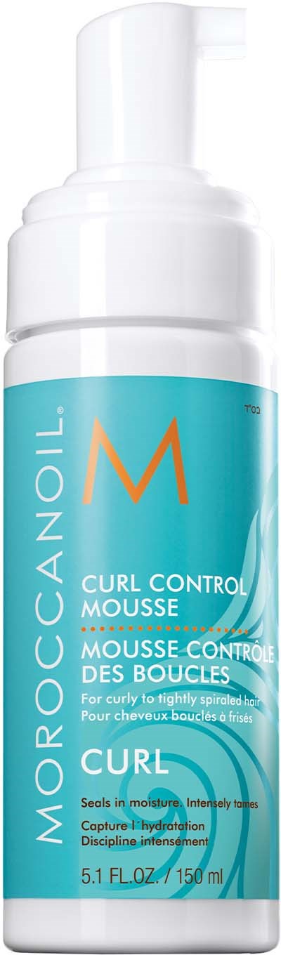 A white bottle with a pump, labeled Moroccanoil Curl Control Mousse, for curly hair. It contains 150 ml.