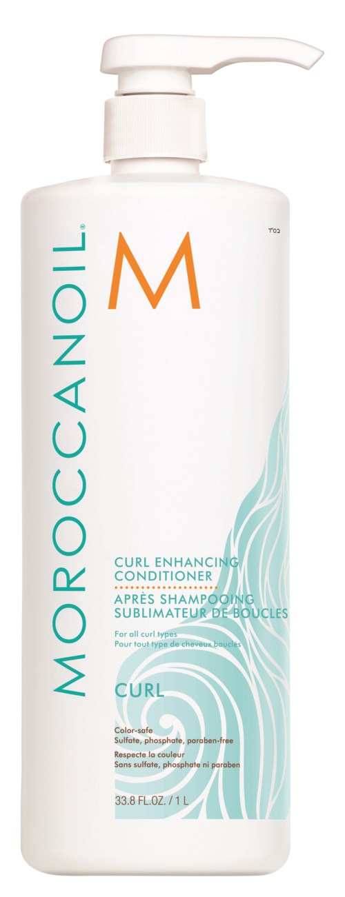 En vit flaska med pump, märkt Moroccanoil Curl Enhancing Conditioner, avsedd för lockigt hårvård.