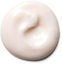En vit, krämig substans med en slät, glänsande yta, kanske lotion eller kräm.