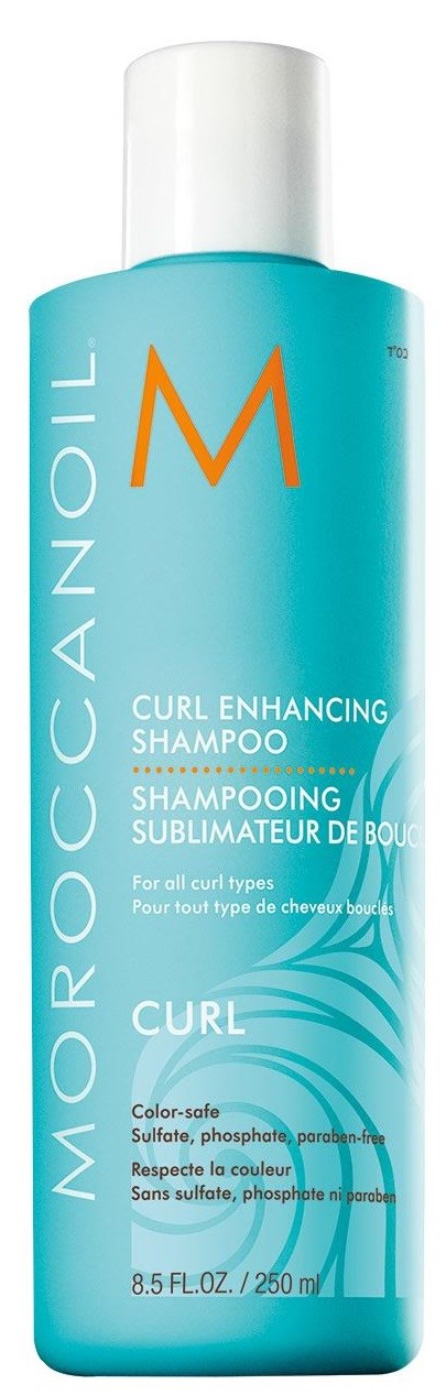 Sininen shampoopullo, jossa oranssi 'M', merkinnällä 'Moroccanoil Curl Enhancing Shampoo'.