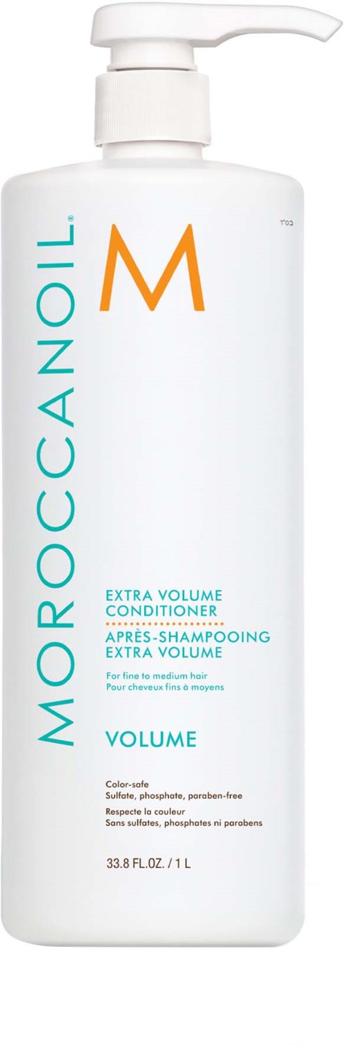 En vit flaska med pump, märkt Moroccanoil Extra Volume Conditioner, avsedd för tjockt hår, med produktdetaljer.