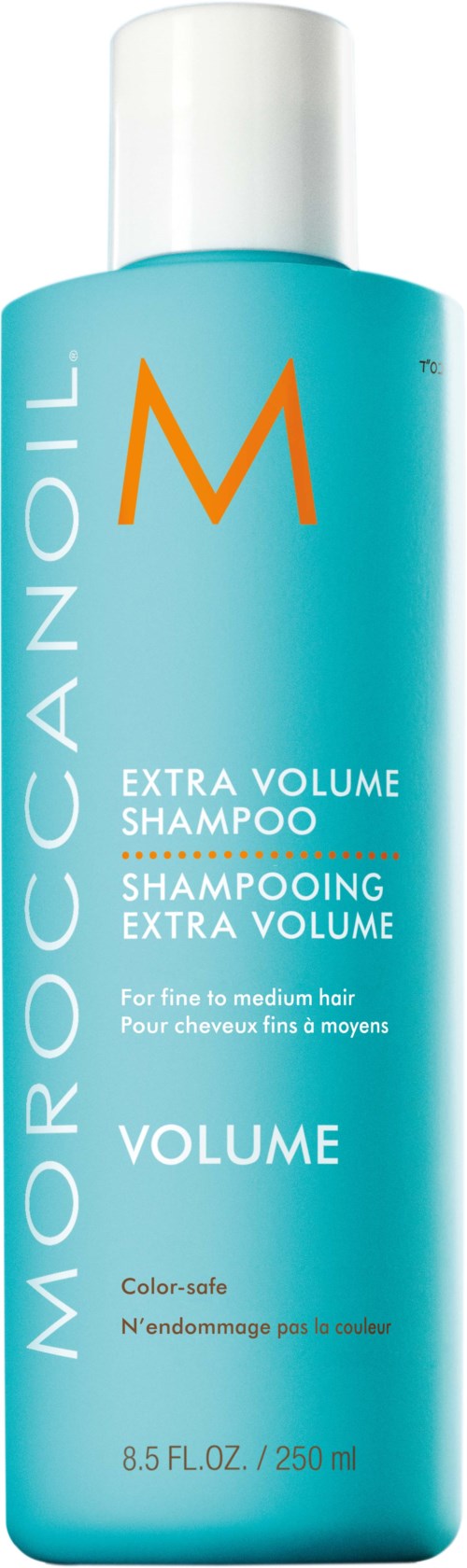 Pitkä, sininen shampoopullo, jossa lukee 'Moroccanoil Extra Volume Shampoo' ja oranssi 'M'-logo.
