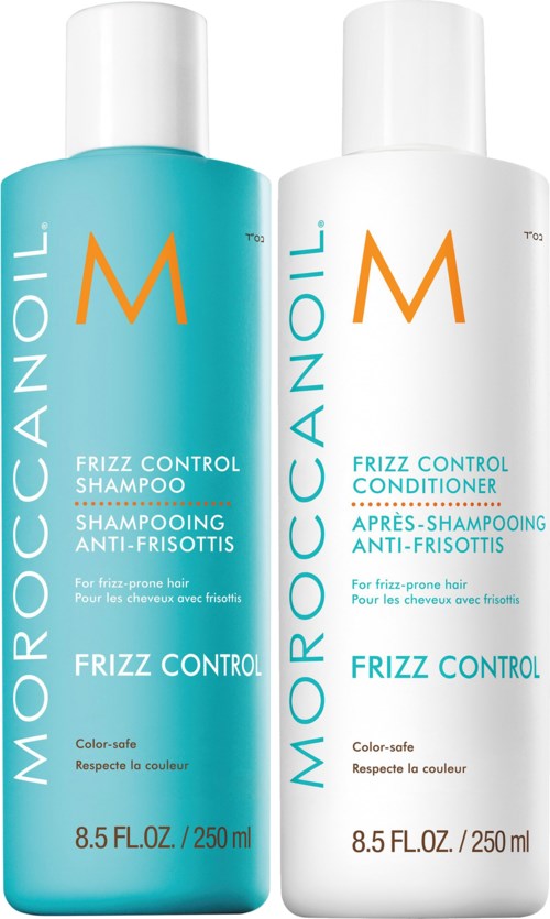 Two bottles of Moroccanoil Frizz Control shampoo and conditioner with white and light blue bottles.