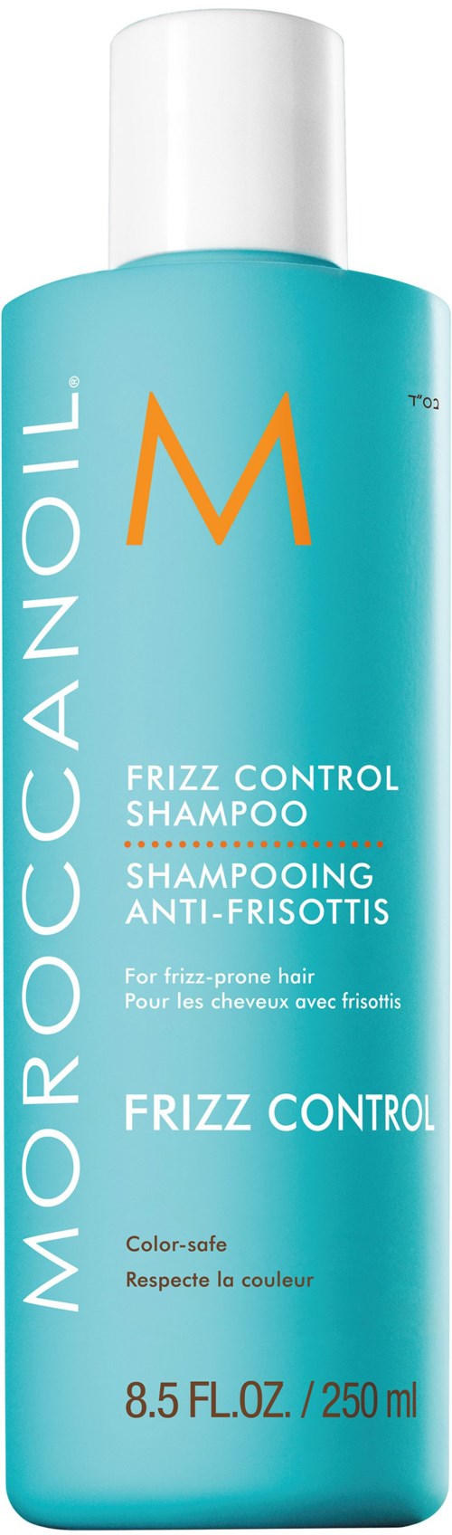 A cylindrical blue bottle of Moroccanoil shampoo with a white cap, labeling it as Frizz Control Shampoo.