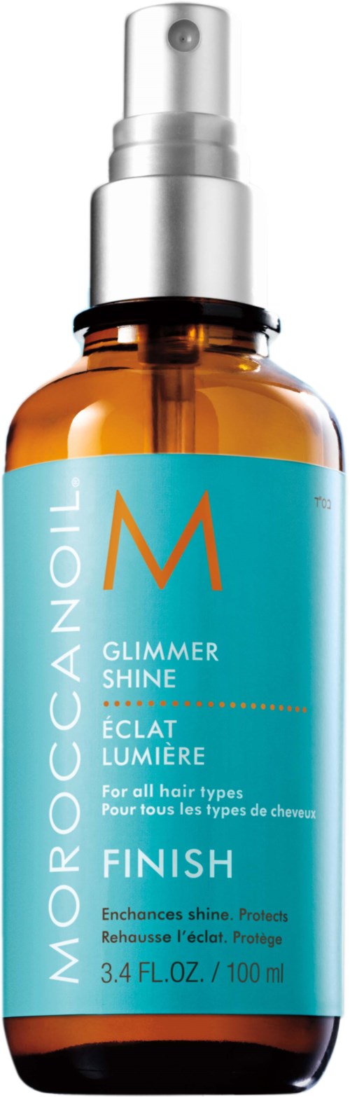 A small amber spray bottle labeled Moroccanoil Glimmer Shine Finish for all hair types, containing 3.4 fluid ounces.