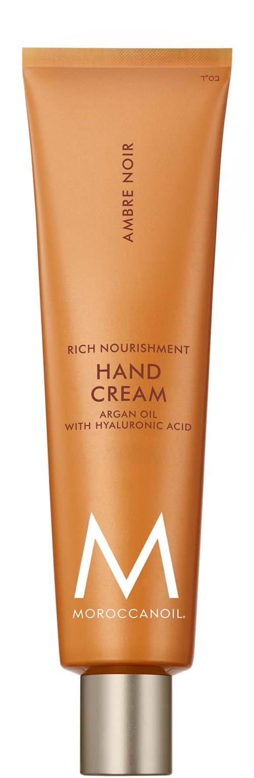 Käsivoideputki, jossa lukee 'Amber Noir', ja siinä tekstit 'Rich Nourishment', 'Argan Oil' ja 'Hyaluronic Acid'.