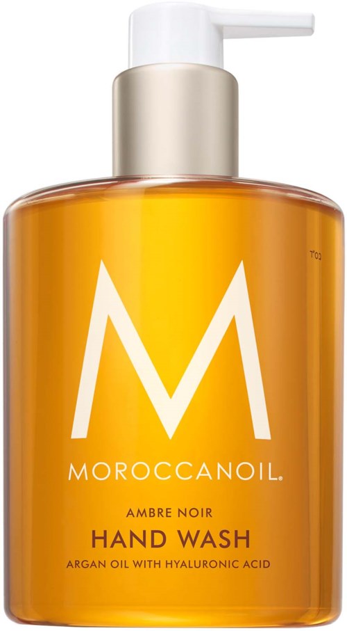 MoroccanOil käsisaippan pullo, oranssi väri, suuri valkoinen M ja pumppulaitteella.