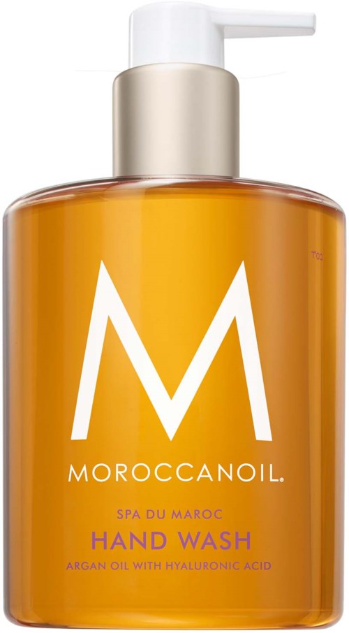 Moroccanoil käsisaippalapullo, oranssi väri, suuri valkoinen M, mainitsee arganöljyä ja hyaluronihappoa.