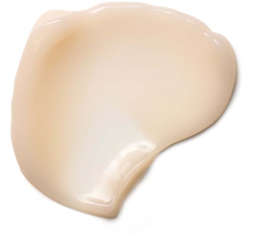A light beige cream or lotion with a smooth, soft texture and shiny surface.