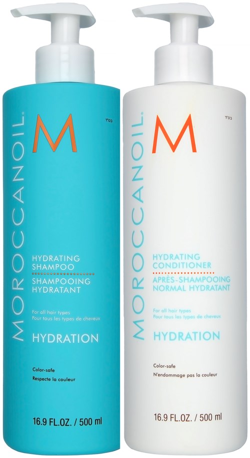 Two large bottles, one blue and one white, with pump caps, labeled for moisturizing shampoo and conditioner.
