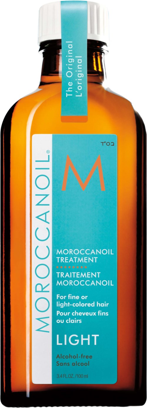 A small brown bottle with a blue label and white cap. The label has text about Moroccan oil for light-colored hair.