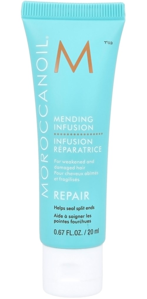 En liten blå tub med reparationshårkräm från MoroccanOil och vit lock.