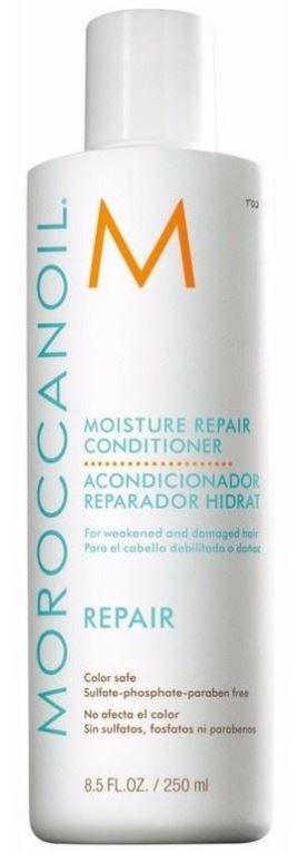 Valkoinen pullo kosteuttavaa hoitoaineita, 'Moroccan Oil' -merkki, vaurioituneelle hiukselle, 8.5 fl oz, 250 ml.