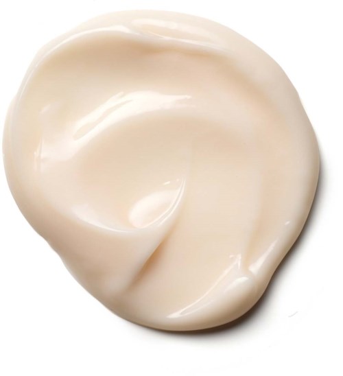 Cream with a smooth, shiny texture shaped into a small swirl or dollop.