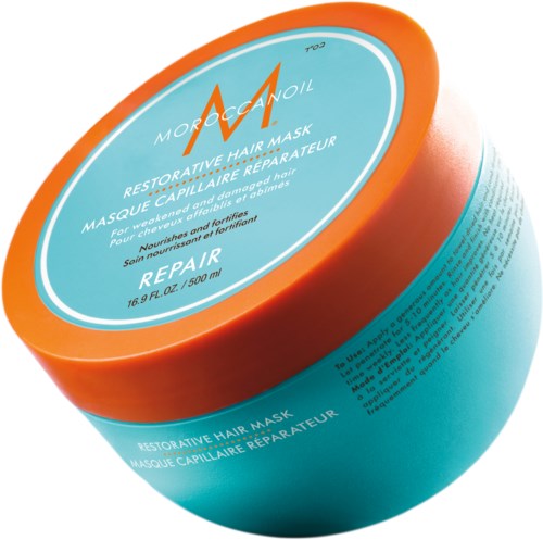 En orange och blå burk av Moroccanoil Restorative Hair Mask för skadat hår, med text och logga på locket.
