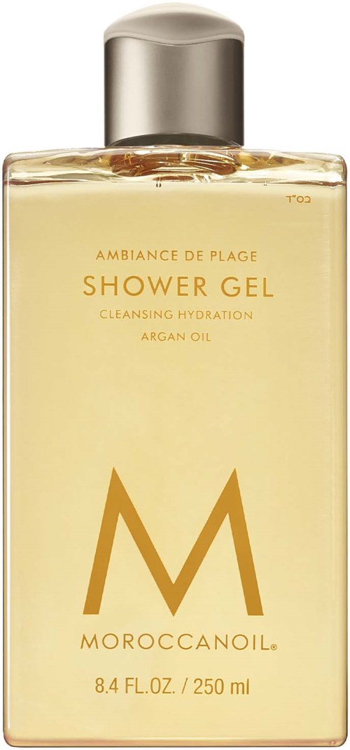 En flaska MoroccanOil duschgel, ljusfärgad vätska inuti, med silverlock och guldig text.