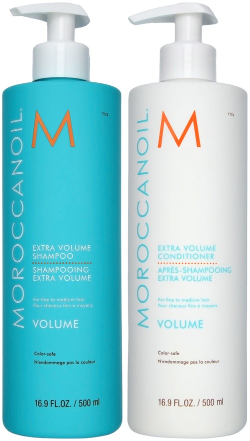 Two bottles of Moroccanoil extra volume shampoo and conditioner with white and blue packaging.