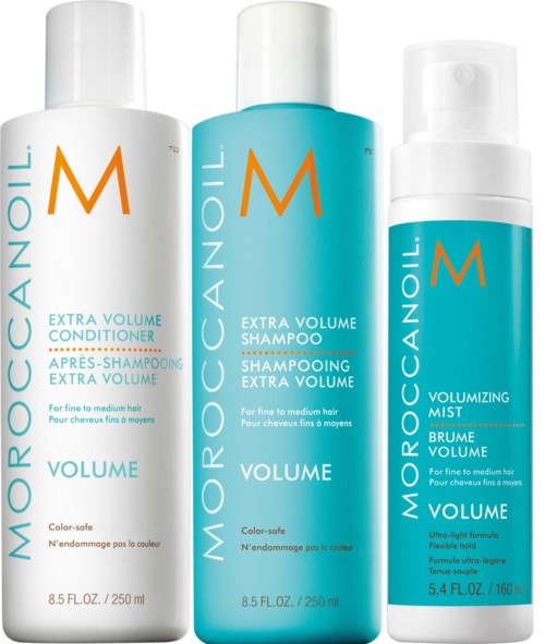 Three hair products: conditioner, shampoo, and mist, all labeled "Volume" for fine to medium hair. Blue and white bottles.