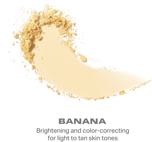 En bananformad pulverprodukt med text om att ljusa och korrigera hudfärg för ljusa till solkyssta toner.
