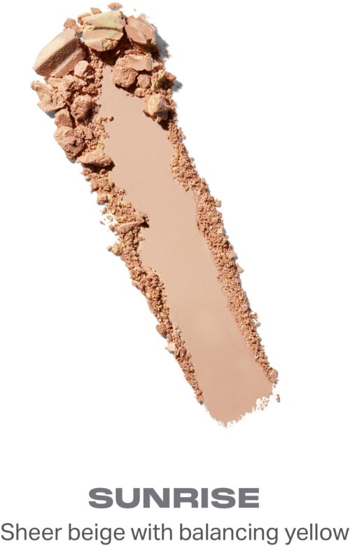 En beige makeupprodukt med några trasiga bitar på toppen, märkt Sunrise, beskrivet som ljusbeige med balanserande gult.