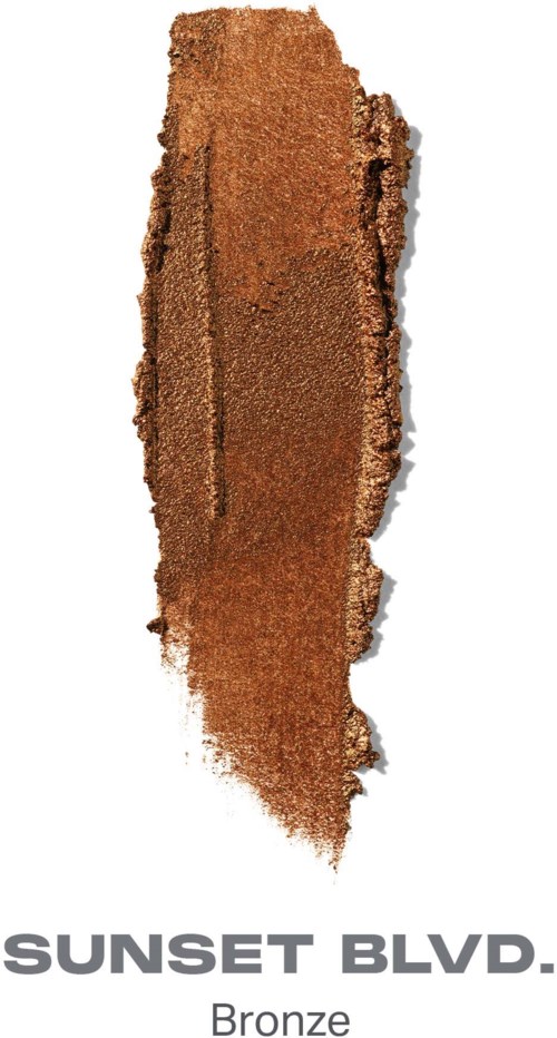 En vertikal remsa av brungult material med icke rena kanter och orden Sunset Blvd. Bronze nedanför.