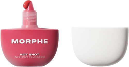 En rosa flaska med Morphe blush drops med en liten boll på toppen, bredvid en vit skål.