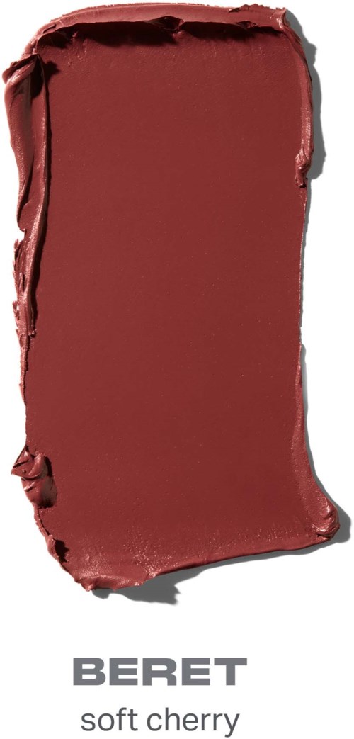 En fläck av djupröd, körsbärsfärgad läppstift med varumärket Beret under.