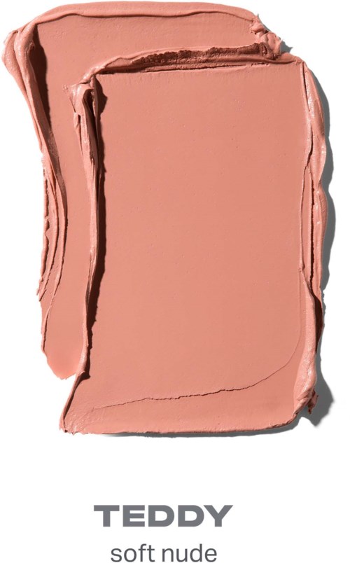 Ett mjukt nude-färgat sminkprodukt med en rektangulär form och slät, krämig konsistens.