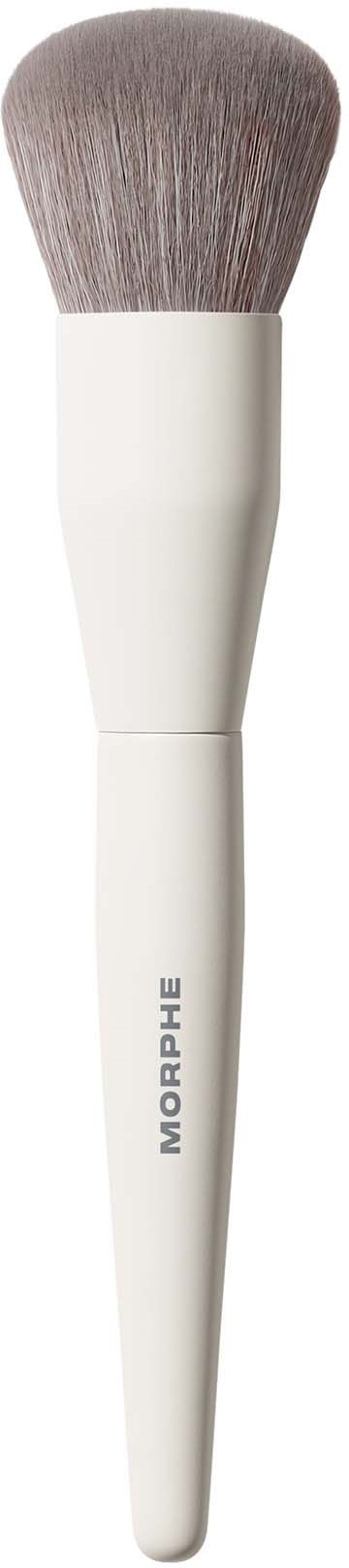 A makeup brush with a white handle and soft bristles used for applying makeup.