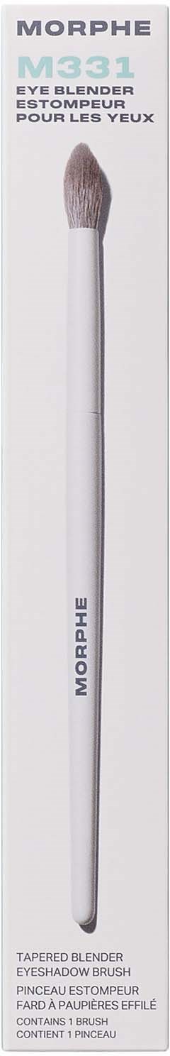 Long white makeup brush with soft bristles, used for eyeshadow application.