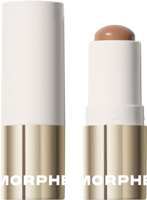 En beige och vit stift med rund topp, står upprätt med locket avtaget och visar produkten inuti.