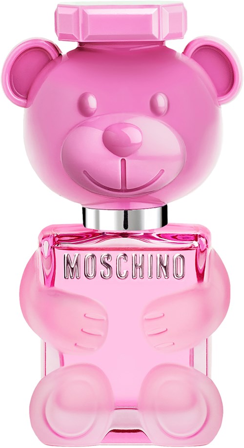 Ein rosa Parfümflasche in Bärenform mit Bärenkopfdeckel, hält ein Schild mit 'MOSCHINO'.