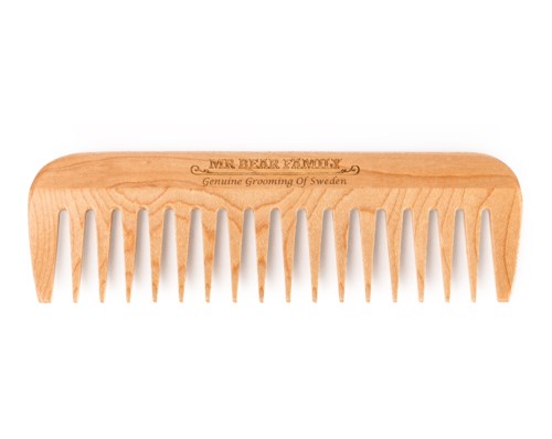 A wooden comb with the words 'Mr. Beard Memory' and 'Genuine Grooming of Sweden' engraved on it.
