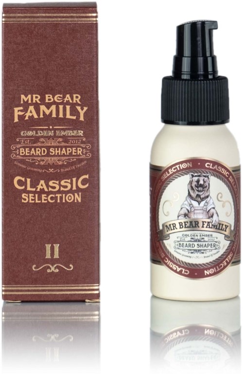 Een kleine witte fles met een zwarte pomp en een label met een beer, naast een bruin doosje. Het merk is Mr Bear Family.