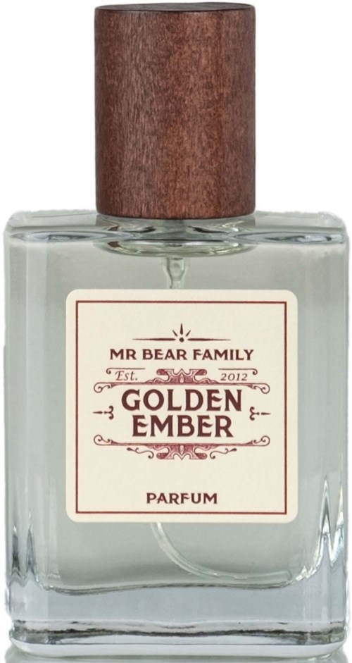 A clear perfume bottle with a wooden cap, labeled 'Golden Ember' by Mr Bear Family, dated 2012.