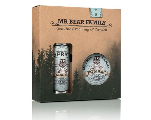 A grooming set for men in a box, includes spray and pomade, with a bear logo and a forest background.