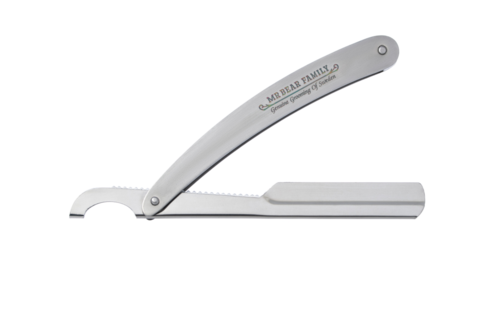 A straight razor with a foldable blade, labeled 'Mr. Bear Family,' used for shaving.