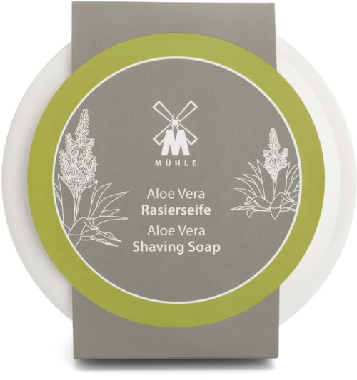A box of aloe vera shaving soap with illustrations of aloe plants, green and gray colors, and a windmill logo.