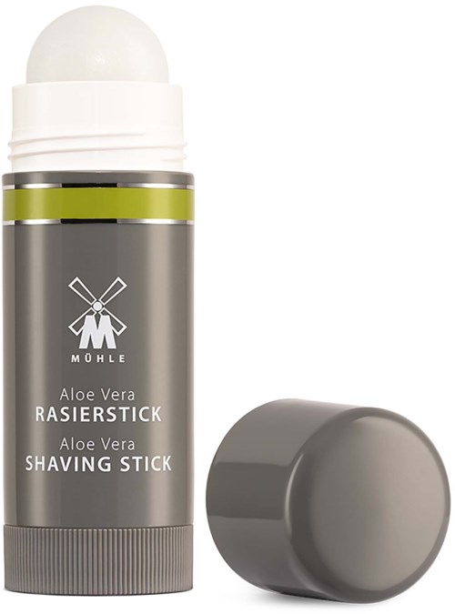 En grå Aloe Vera rakpinnar med avtagit lock, visar den vita rakprodukten inuti.
