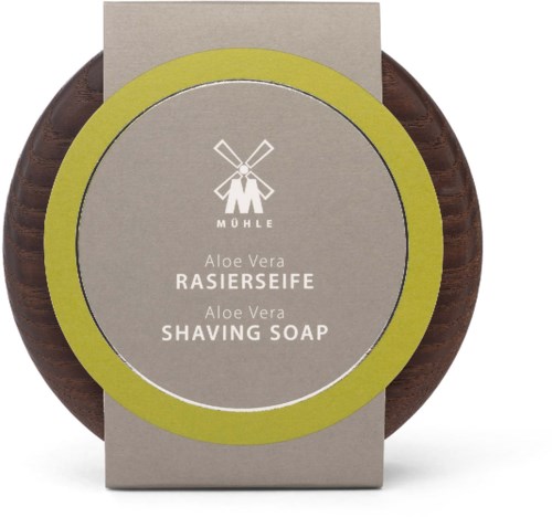 Rund brun barberkrem med grå etikett og grønt rammer, viser MÖHLE-logoen og produktdetaljer for Aloe Vera.